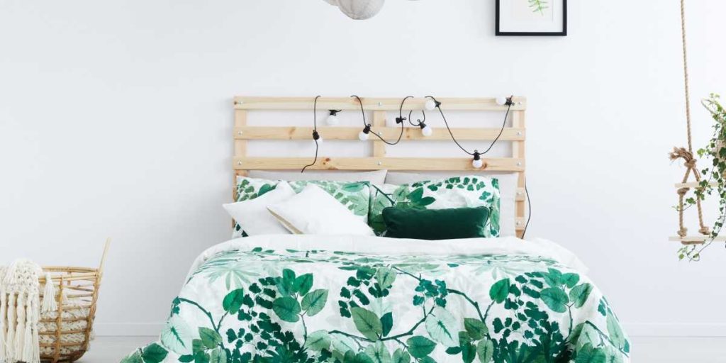 bed with green floral bed spread