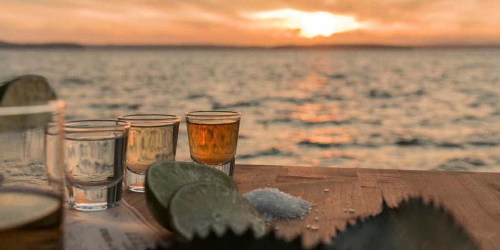 flight of tequila at sunset on the beach