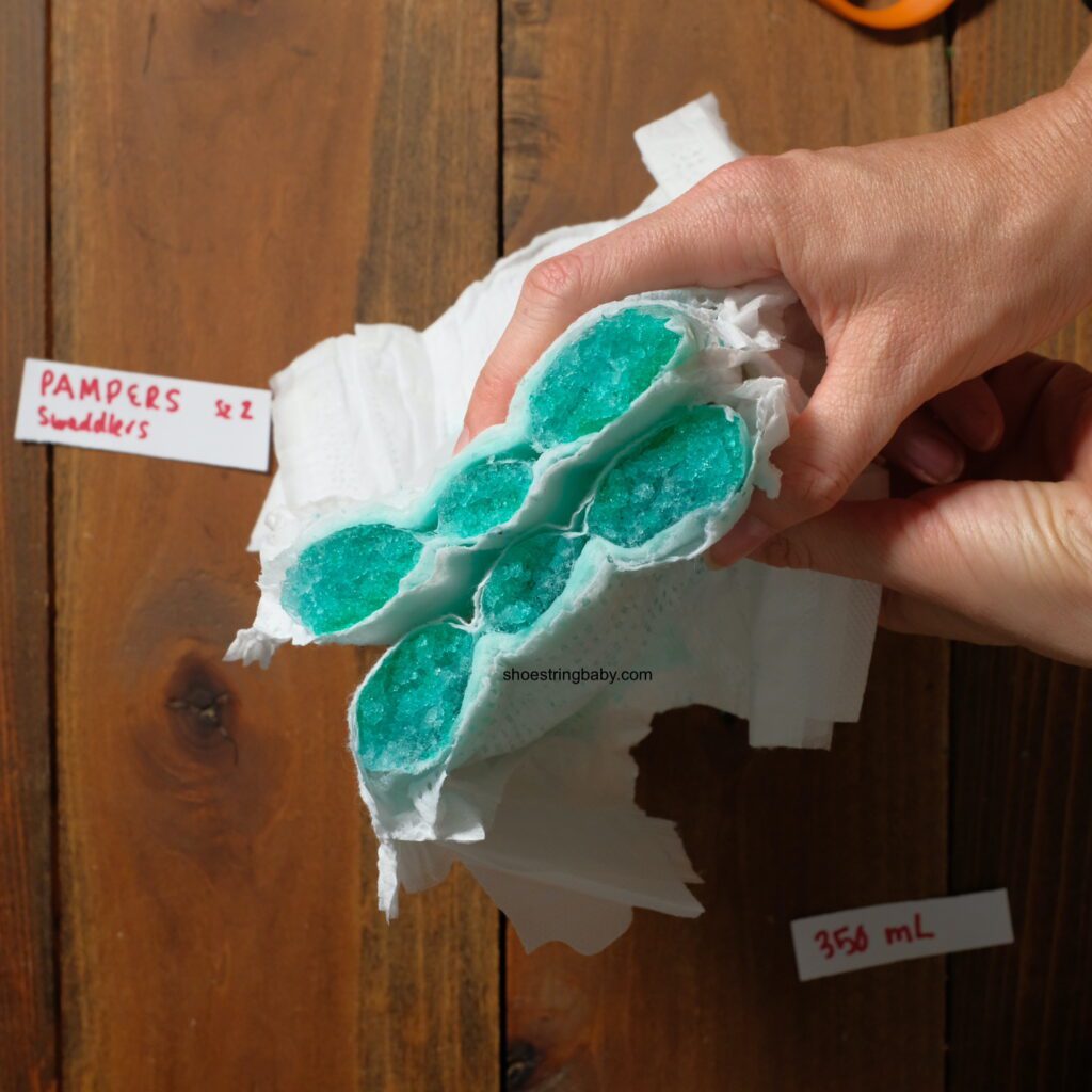 Pampers swaddlers diaper cut in half to show absorbent inner filling