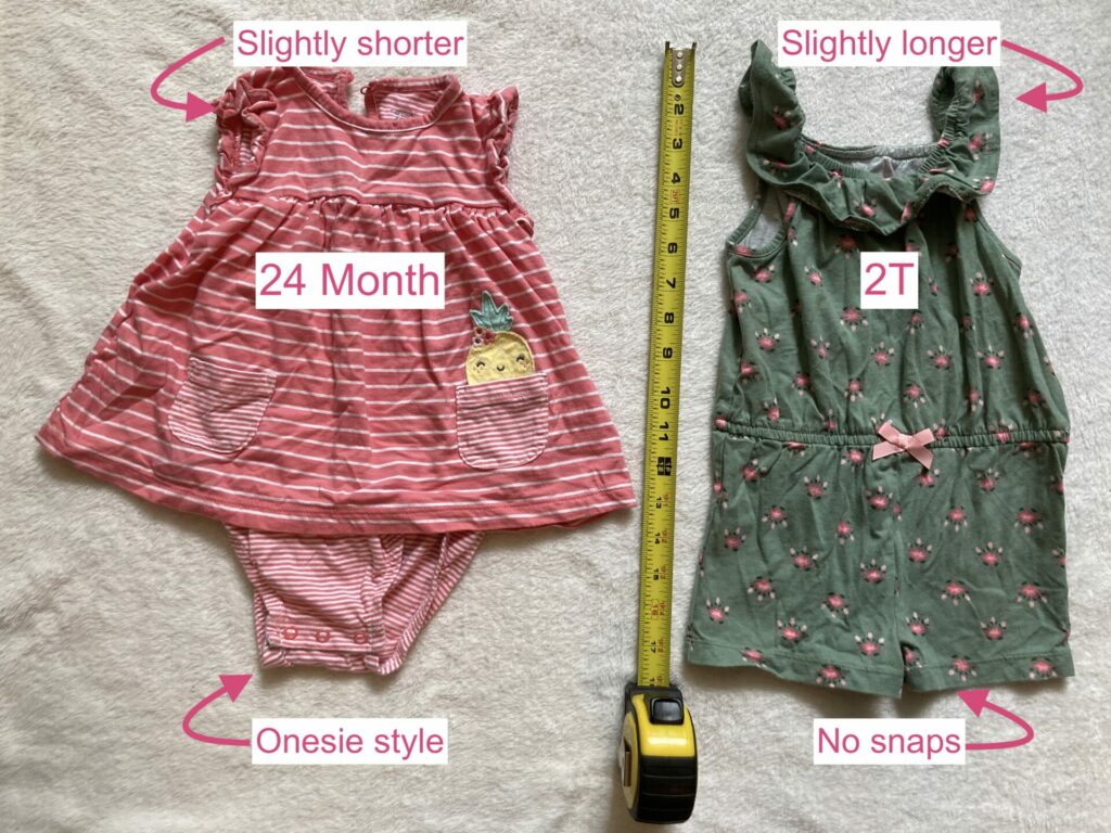 Picture showing the difference between a 24 month and 2T romper from Carter's. Labels to show 24 month outfit having diaper access snaps while 2T does not, and the 2T romper being slightly longer.
