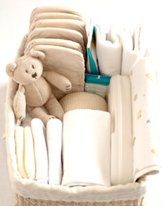 basket of baby gear like diapers and blankets
