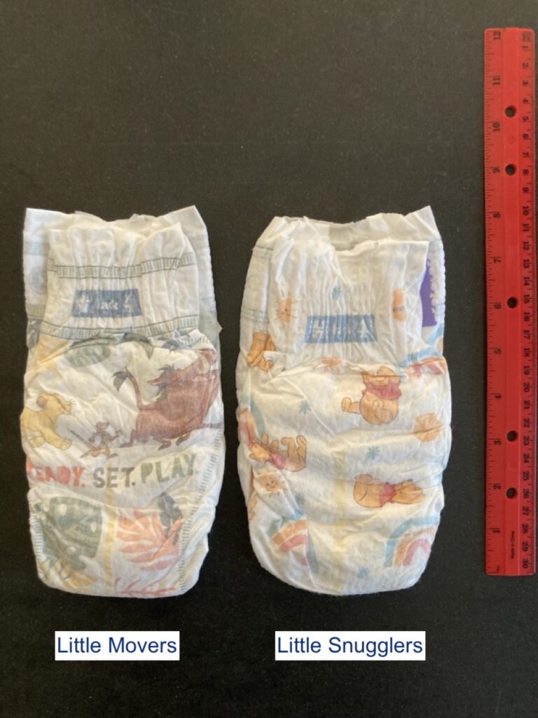 back of huggies little snugglers vs. little movers diapers with ruler for scale