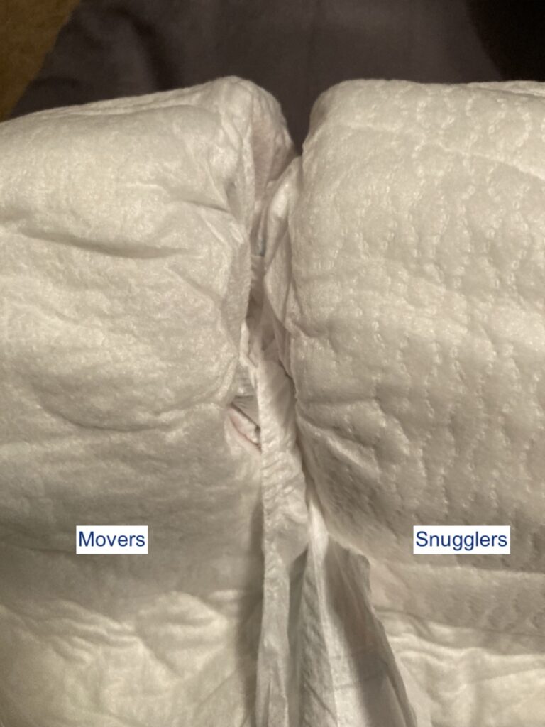 close up comparing the inner lining of huggies little movers vs little snugglers diapers
