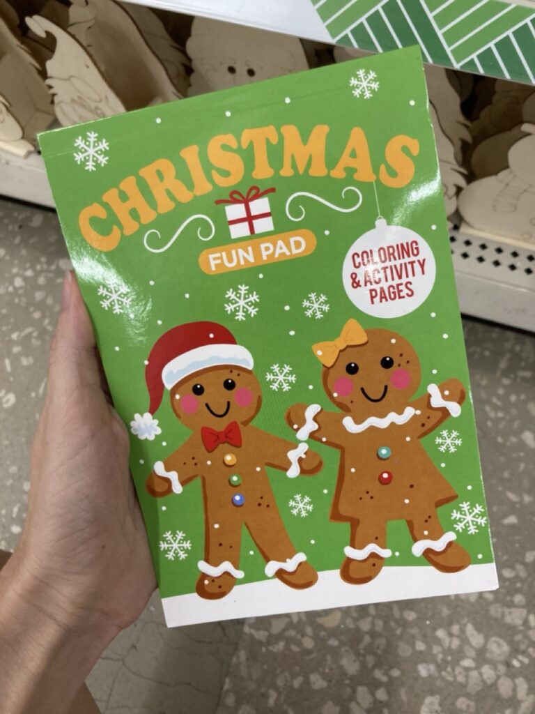a christmas activity book with gingerbread men on the cover