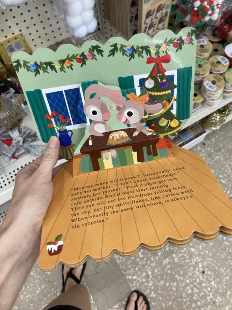 a pop-up christmas book with bunnies popping up