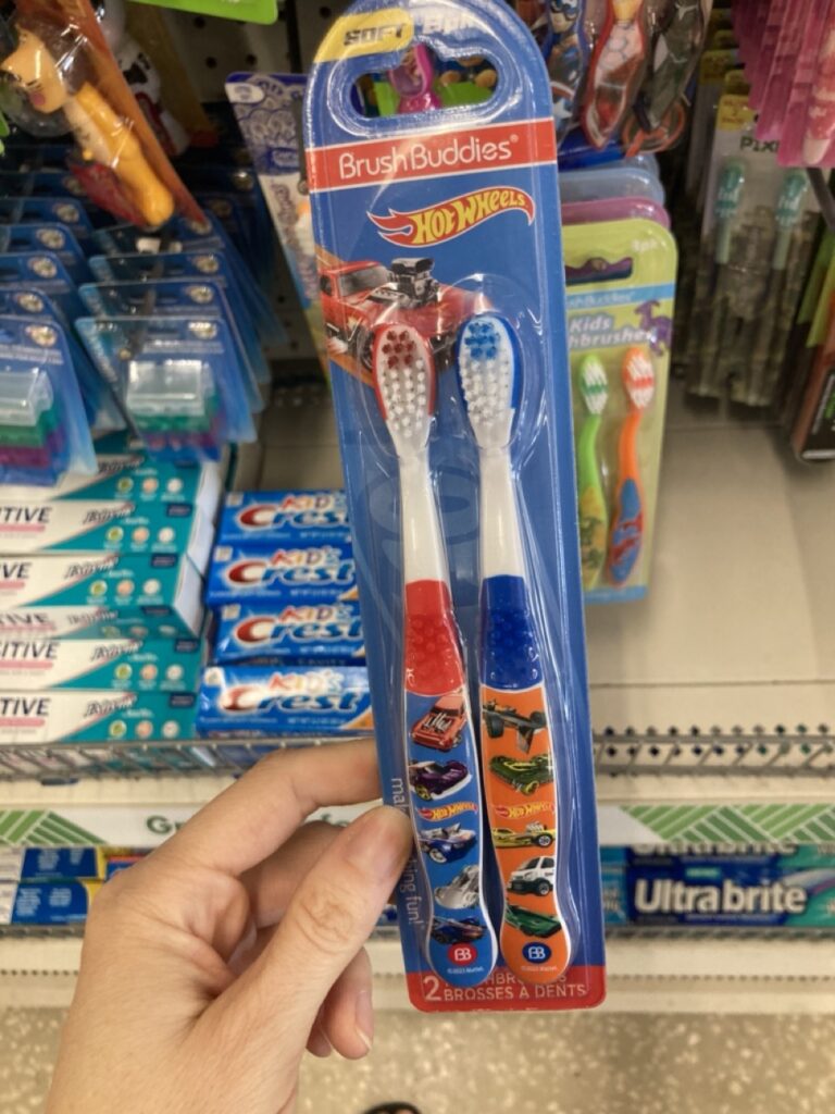 a set of kids toothbrushes with cars on them