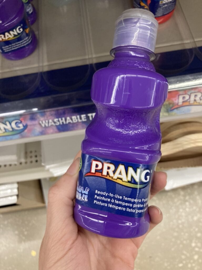 a bottle of purple washable paint