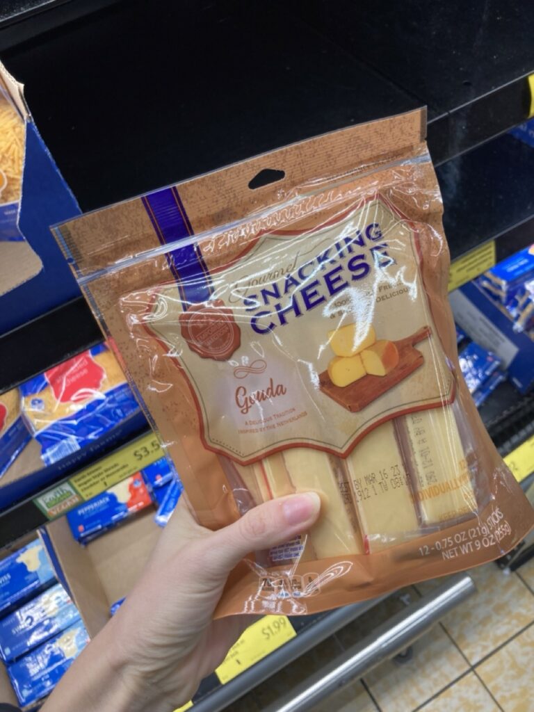 aldi gouda snack cheese bag being shown by a hand