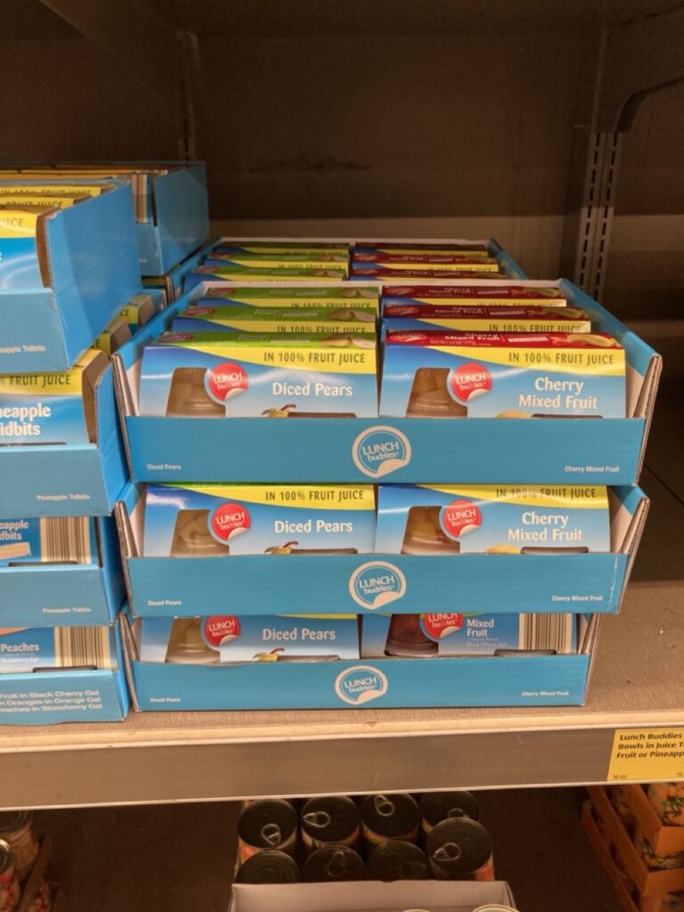 fruit in a cup packages in boxes on the shelf at aldi