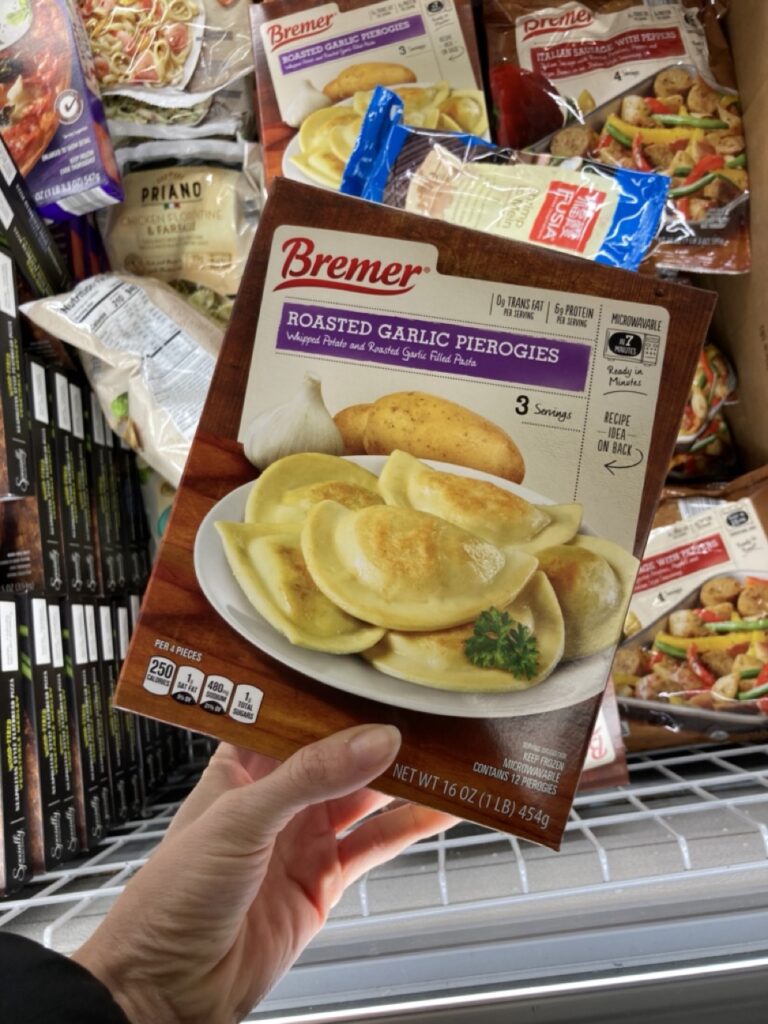 a box of pierogis being shown by a hand
