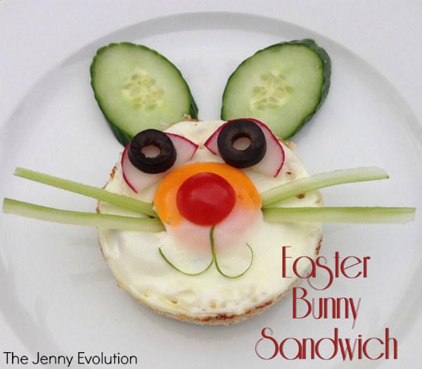 This is an open faced sandwich with vegetables arranged to make it look like a bunny face