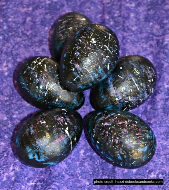 Black eggs painted to look like a galaxy