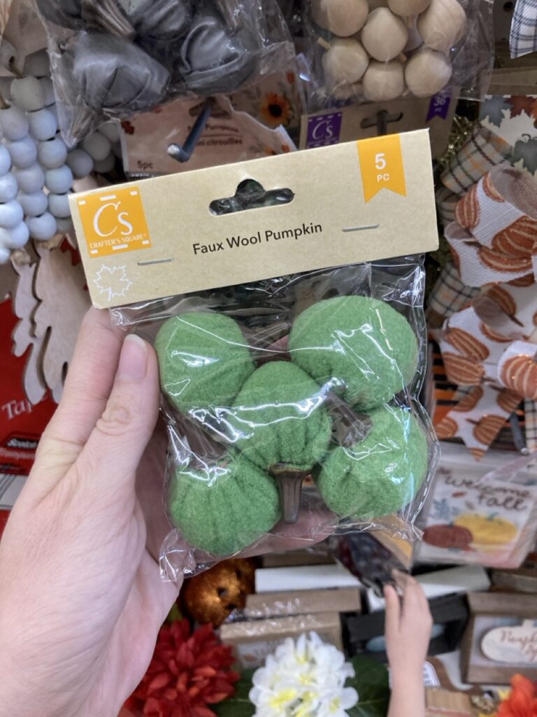 little green felt pumpkins in a package