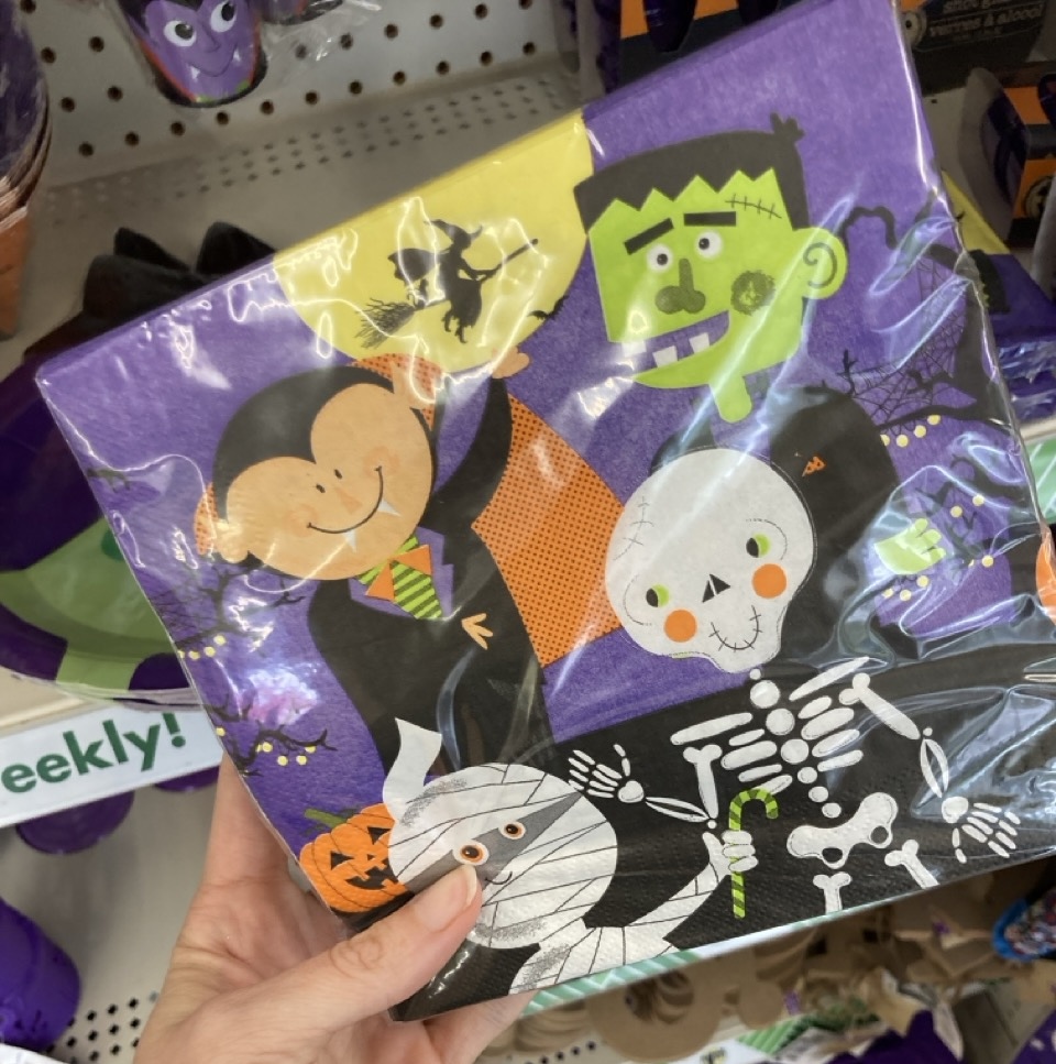 a pack of napkins with a vampire, frankenstein, skeleton and mummy on them
