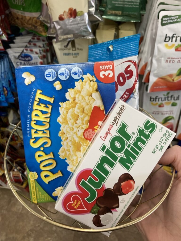 a movie night basket with popcorn, junior mints and combos