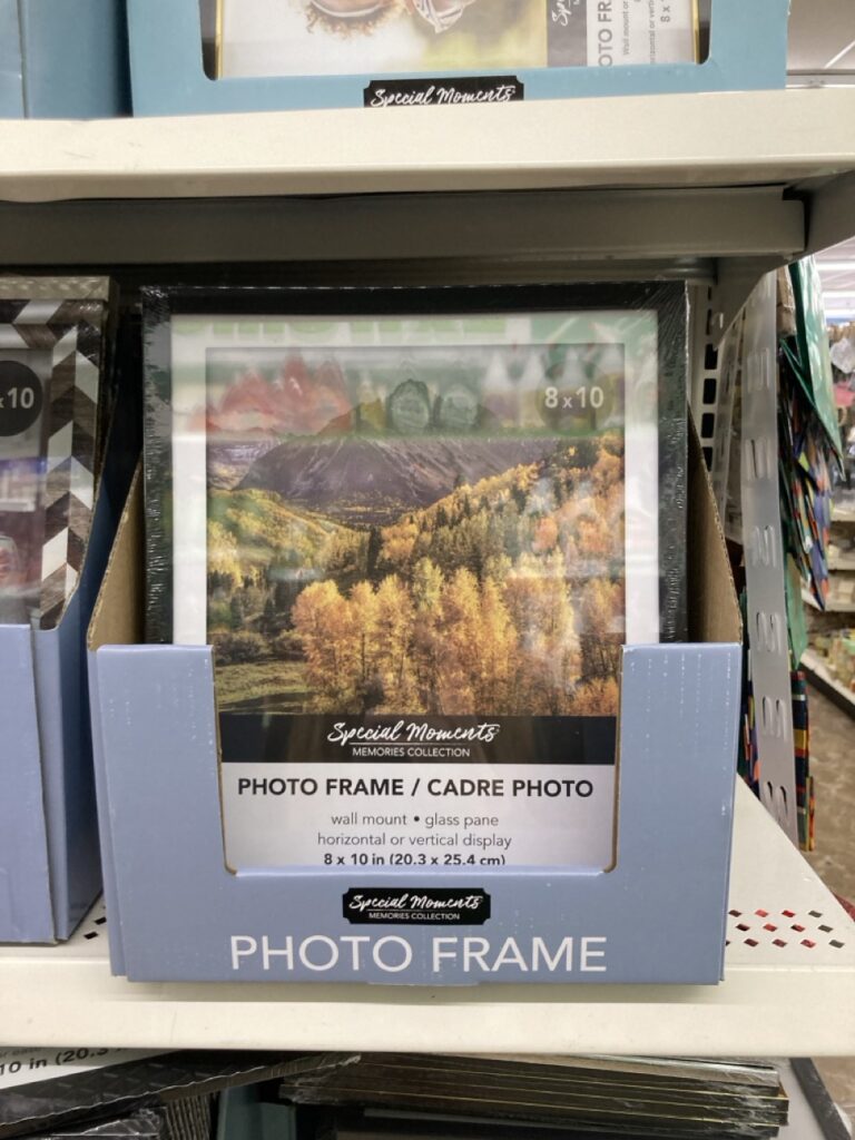 a box of photo frames on a shelf