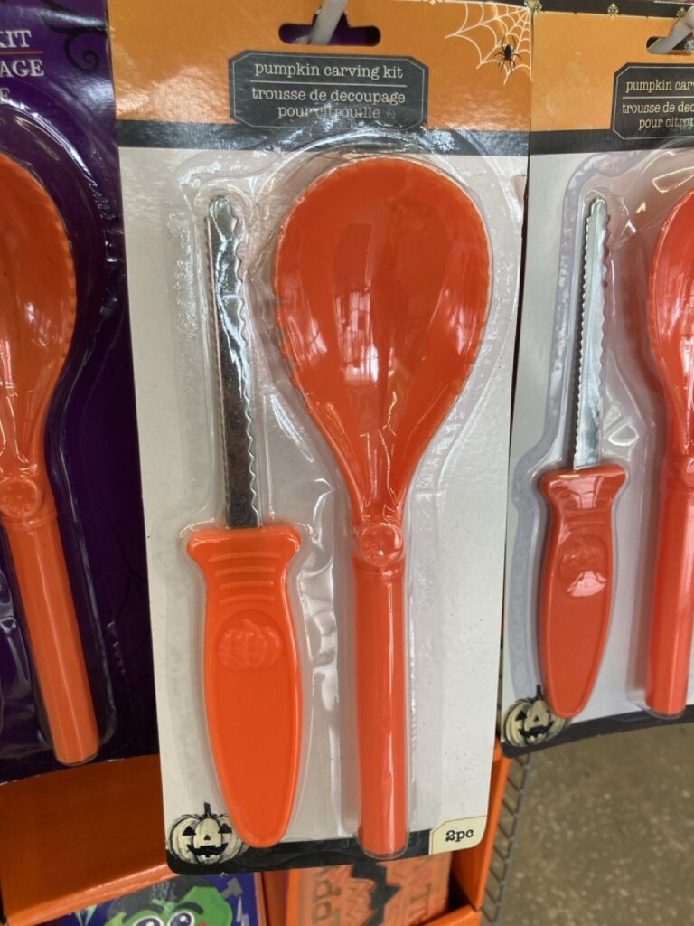 a packaged pumpkin carving kit with a knife and scooper