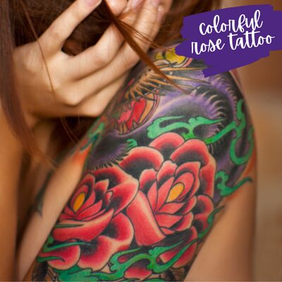 a colorful bicep sleeve tattoo of roses