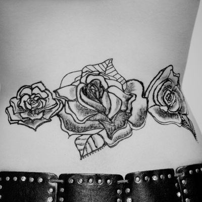 three big roses as a tattoo on the back