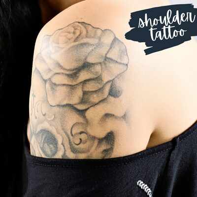 a black rose shoulder tattoo