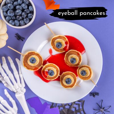 pancake skewers that look like eyeballs with blueberries as pupils