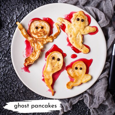 pancakes shaped like ghosts with jam underneath them