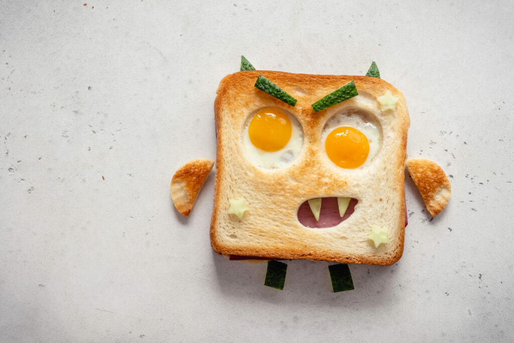 monster egg toast: eggs in holes in toast made to look like eyes of a monster