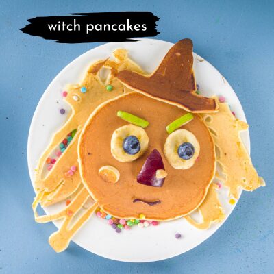 pancake made to look like a witch with fruit